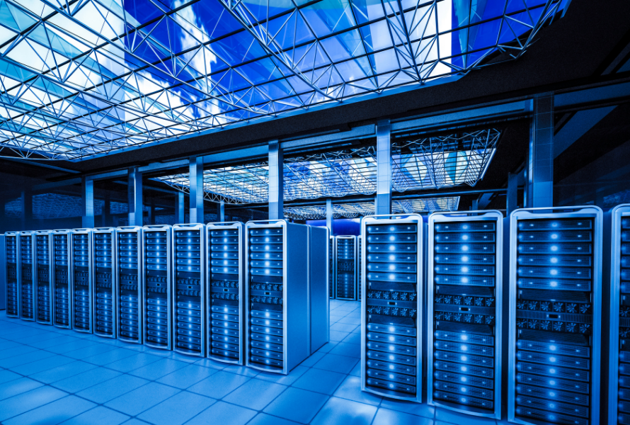 Rows of illuminated server racks in a blue-lit data center hall